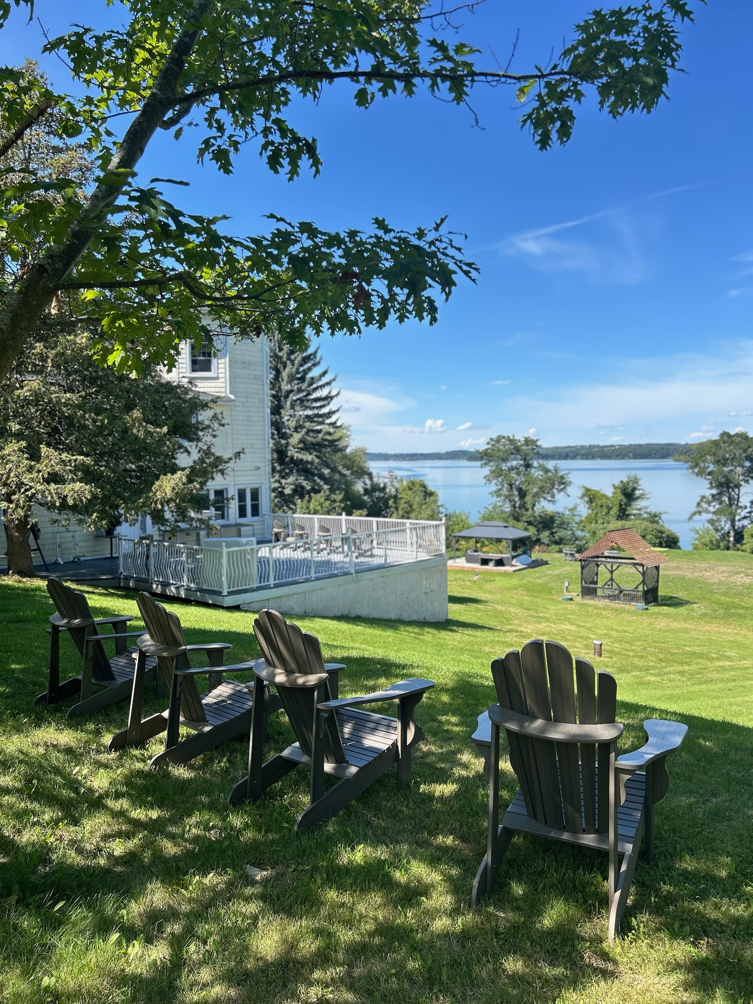 Relaxing by the outdoor fireplace overlooking the lake